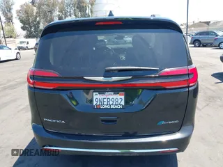 2021 Chrysler Pacifica Hybrid Touring L with VIN 2C4RC1L71MR599631, listed as a IAAI auction lot 42151965 with 67,401 mi miles and . Bid and sale history available at DreamBid. Image 16.