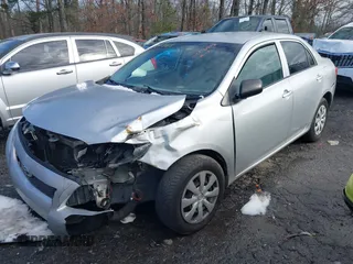 2009 Toyota Corolla with VIN JTDBL40E899083155, listed as a IAAI auction lot 41056942 with 294,132 mi miles. Bid and sale history available at carsss.com. Image 2.