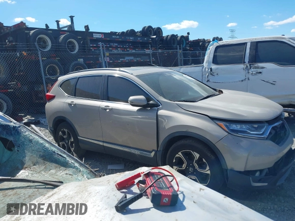 2018 Honda CR-V Touring with VIN 5J6RW1H98JL000031, listed as a IAAI auction lot 40605651 with 129,516 mi miles and . Bid and sale history available at DreamBid. Image 12.