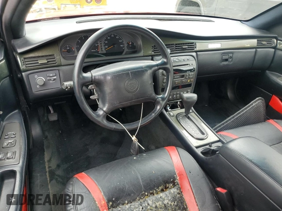 2002 Cadillac Eldorado z VIN 1G6EC129X2B106142, wystawiony jako Copart lot #74424164 z przebiegiem Nie podano mil oraz Szkoda całkowita • Salvage title. Historia ofert i sprzedaży dostępna na DreamBid. Obrazek 8.