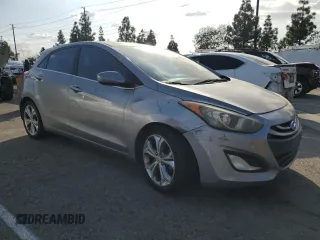 2013 Hyundai Elantra GT with VIN KMHD35LE2DU098164, listed as a Copart auction lot 77272174 with 165,061 mi miles and Salvage Title. Bid and sale history available at carsss.com. Image 4.