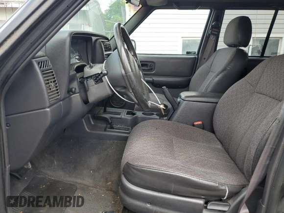 2000 Jeep Cherokee Classic with VIN 1J4FF58S8YL119611, listed as a Copart auction lot 57255685 with 148,908 mi miles and Clean title. Bid and sale history available at DreamBid. Image 7.