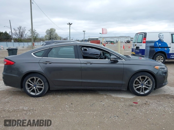 2019 Ford Fusion SEL with VIN 3FA6P0CDXKR129411, listed as a IAAI auction lot 42082323 with 126,048 mi miles and . Bid and sale history available at DreamBid. Image 13.