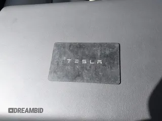2023 Tesla Model Y Long Range with VIN 7SAYGDEE7PF832007, listed as a IAAI auction lot 41751598 with 14,126 mi miles and . Bid and sale history available at DreamBid. Image 11.