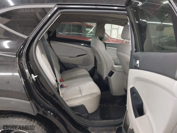 2018 Hyundai Tucson Value with VIN KM8J3CA28JU648236, listed as a IAAI auction lot 41161221 with 104,057 mi miles. Bid and sale history available at carsss.com. Image 8.
