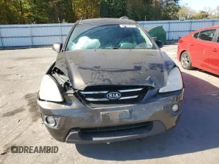 2009 Kia Rondo LX Base with VIN KNAFG528497260778, listed as a Copart auction lot 76497534 with 276,585 mi miles and Salvage Title. Bid and sale history available at carsss.com. Image 5.