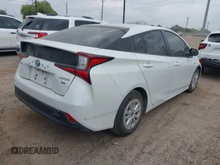 2021 Toyota Prius L Eco with VIN JTDKAMFU5M3132103, listed as a IAAI auction lot 42061511 with 42,116 mi miles and . Bid and sale history available at DreamBid. Image 4.