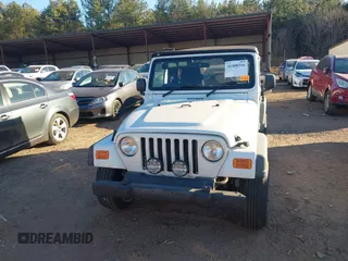 2004 Jeep Wrangler Sport Right Hand Drive with VIN 1J4F449S74P732854, listed as a IAAI auction lot 41408316 with 112,064 mi miles. Bid and sale history available at carsss.com. Image 12.