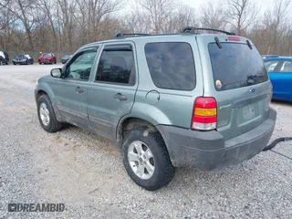 2007 Ford Escape XLT with VIN 1FMYU03107KA50631, listed as a IAAI auction lot 41374784 with 174,870 mi miles. Bid and sale history available at carsss.com. Image 3.