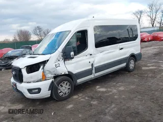 2021 Ford Transit Passenger XL with VIN 1FBAX2C82MKA32735, listed as a IAAI auction lot 41312892 with 62,053 mi miles and . Bid and sale history available at DreamBid. Image 2.