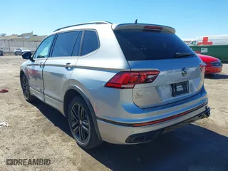 2022 Volkswagen Tiguan SE R-Line Black with VIN 3VVCB7AX4NM008121, listed as a IAAI auction lot 41671382 with 71,674 mi miles. Bid and sale history available at carsss.com. Image 3.