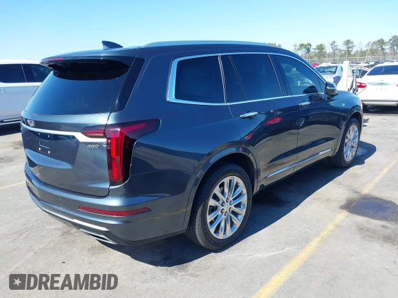 2021 Cadillac XT6 Premium Luxury with VIN 1GYKPERS0MZ110029, listed as a IAAI auction lot 41669104 with 58,890 mi miles and . Bid and sale history available at DreamBid. Image 4.