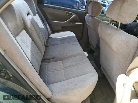 2000 Toyota Camry CE z VIN 4T1BG22K0YU708702, wystawiony jako Copart lot #56755285 z przebiegiem 318 734 mil mil oraz Szkoda całkowita • Salvage title. Historia ofert i sprzedaży dostępna na DreamBid. Obrazek 10.