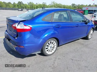 2014 Ford Fiesta SE with VIN 3FADP4BJ5EM190009, listed as a IAAI auction lot 42036976 with 157,575 mi miles. Bid and sale history available at carsss.com. Image 4.