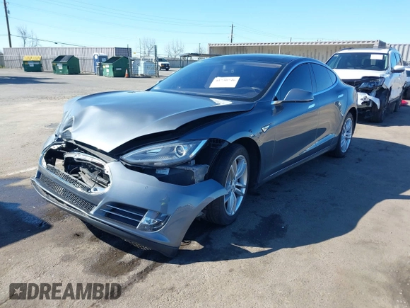 2014 Tesla Model S 60 with VIN 5YJSA1S10EFP32851, listed as a IAAI auction lot 41730746 with 91,657 mi miles and . Bid and sale history available at DreamBid. Image 2.