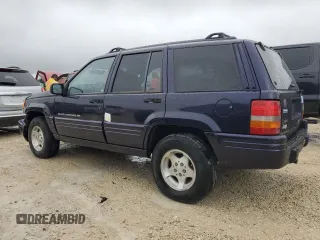 1998 Jeep Grand Cherokee with VIN 1J4FX48S1WC244308, listed as a Copart auction lot 74384714 with Not provided miles and Non repairable. Bid and sale history available at DreamBid. Image 2.