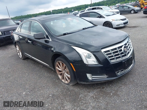 2013 Cadillac XTS Luxury z VIN 2G61P5S34D9183065, wystawiony jako IAAI lot #42665741 z przebiegiem 209 585 mil mil oraz . Historia ofert i sprzedaży dostępna na DreamBid. Obrazek 1.