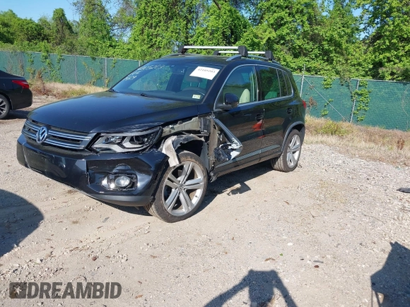 2014 Volkswagen Tiguan S z VIN WVGBV3AX5EW560393, wystawiony jako IAAI lot #42105203 z przebiegiem 102 001 mil mil oraz . Historia ofert i sprzedaży dostępna na DreamBid. Obrazek 2.
