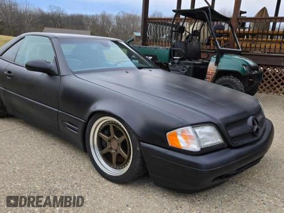 1999 Mercedes-Benz SL 500 with VIN WDBFA68FXXF184548, listed as a Copart auction lot 48104955 with 133,450 mi miles and Clean title. Bid and sale history available at DreamBid. Image 1.