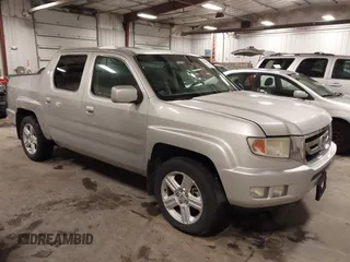 2009 Honda Ridgeline RTL with VIN 2HJYK16519H000129, listed as a IAAI auction lot 41891810 with 186,124 mi miles. Bid and sale history available at carsss.com. Image 1.