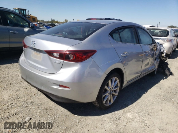 2017 Mazda 3 Touring z VIN 3MZBN1V79HM119726, wystawiony jako Copart lot #60819782 z przebiegiem 108 939 mil mil oraz Szkoda całkowita • Salvage title. Historia ofert i sprzedaży dostępna na DreamBid. Obrazek 4.