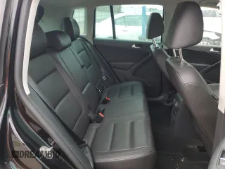 2014 Volkswagen Tiguan S z VIN WVGBV3AX5EW554500, wystawiony jako Copart lot #57016775 z przebiegiem 91 101 mil mil oraz Szkoda całkowita • Salvage title. Historia ofert i sprzedaży dostępna na DreamBid. Obrazek 11.