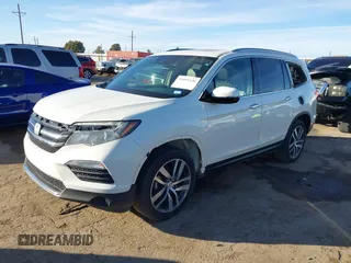2017 Honda Pilot Touring with VIN 5FNYF6H93HB056387, listed as a IAAI auction lot 41095336 with 90,376 mi miles and . Bid and sale history available at DreamBid. Image 17.
