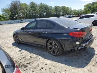 2018 BMW 5 Series M550i xDrive with VIN WBAJB9C56JB286479, listed as a Copart auction lot 57108645 with 71,782 mi miles and Salvage title. Bid and sale history available at DreamBid. Image 2.