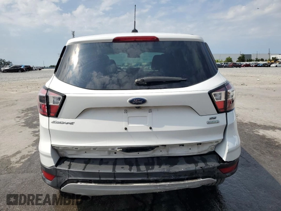 2017 Ford Escape SE z VIN 1FMCU0GD9HUE38848, wystawiony jako Copart lot #56859745 z przebiegiem 69 404 mil mil oraz Szkoda całkowita • Salvage title. Historia ofert i sprzedaży dostępna na DreamBid. Obrazek 6.