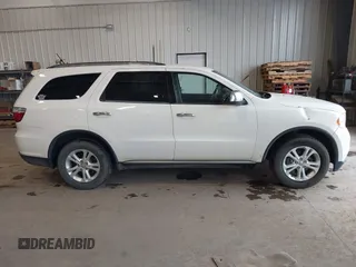 2012 Dodge Durango SXT with VIN 1C4RDJAGXCC295138, listed as a IAAI auction lot 42333094 with 96,581 mi miles and . Bid and sale history available at DreamBid. Image 13.