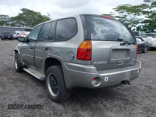 2005 GMC Envoy SLT z VIN 1GKDS13S152161472, wystawiony jako IAAI lot #40110978 z przebiegiem 141 908 mil mil oraz . Historia ofert i sprzedaży dostępna na DreamBid. Obrazek 3.