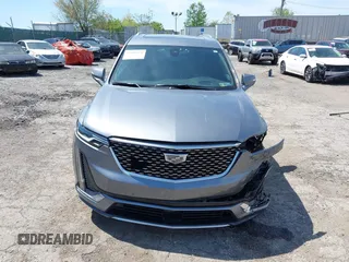 2022 Cadillac XT6 Premium Luxury z VIN 1GYKPDRS4NZ146284, wystawiony jako IAAI lot #42150678 z przebiegiem 28 890 mil mil oraz . Historia ofert i sprzedaży dostępna na DreamBid. Obrazek 13.