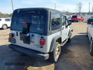 2004 Jeep Wrangler Sport Right Hand Drive with VIN 1J4F449SX4P780560, listed as a IAAI auction lot 41645721 with 146,681 mi miles. Bid and sale history available at carsss.com. Image 3.