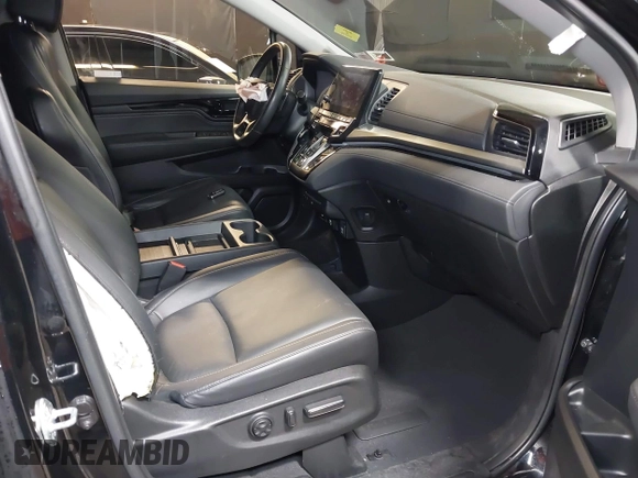 2021 Honda Odyssey Touring with VIN 5FNRL6H83MB040138, listed as a IAAI auction lot 39150096 with 61,322 mi miles and . Bid and sale history available at DreamBid. Image 5.