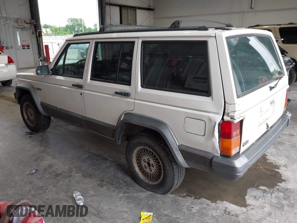 1996 Jeep Cherokee Country z VIN 1J4FT78S0TL280645, wystawiony jako IAAI lot #42340813 z przebiegiem 288 418 mil mil oraz . Historia ofert i sprzedaży dostępna na DreamBid. Obrazek 3.