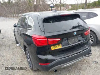 2018 BMW X1 xDrive28i with VIN WBXHT3C34J5K21576, listed as a IAAI auction lot 41822390 with 69,645 mi miles. Bid and sale history available at carsss.com. Image 3.