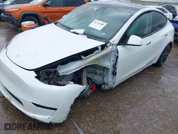 2023 Tesla Model Y Performance with VIN 7SAYGDEF7PF807312, listed as a IAAI auction lot 41711068 with 25,029 mi miles and . Bid and sale history available at DreamBid. Image 2.