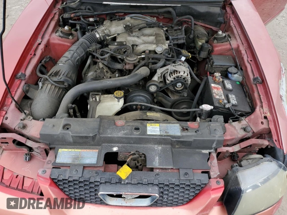 2002 Ford Mustang Standard z VIN 1FAFP40412F107189, wystawiony jako Copart lot #58425645 z przebiegiem 148 551 mil mil oraz Szkoda całkowita • Salvage title. Historia ofert i sprzedaży dostępna na DreamBid. Obrazek 11.