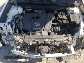 2018 Mazda CX-5 Touring z VIN JM3KFACM7J0370737, wystawiony jako Copart lot #60113725 z przebiegiem 131 385 mil mil oraz Szkoda całkowita • Salvage title. Historia ofert i sprzedaży dostępna na DreamBid. Obrazek 11.