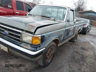 1990 Ford F-150 "S" with VIN 1FTDF15Y4LNB46798, listed as a IAAI auction lot 41767651 with 578,470 mi miles. Bid and sale history available at carsss.com. Image 2.
