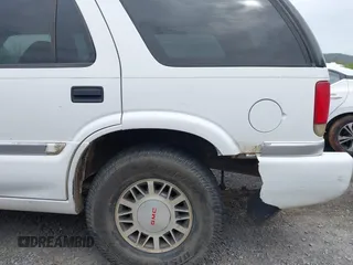 1999 GMC Jimmy SLE with VIN 1GKDT13WXX2521082, listed as a IAAI auction lot 42079903 with 160,055 mi miles. Bid and sale history available at carsss.com. Image 13.