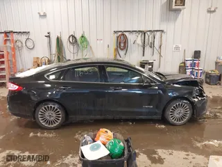 2014 Ford Fusion Titanium Hybrid with VIN 3FA6P0RUXER355654, listed as a IAAI auction lot 41611653 with 211,353 mi miles. Bid and sale history available at carsss.com. Image 13.