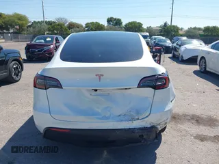 2024 Tesla Model Y with VIN 7SAYGDED9RF161420, listed as a IAAI auction lot 41892788 with 12,353 mi miles and . Bid and sale history available at DreamBid. Image 16.