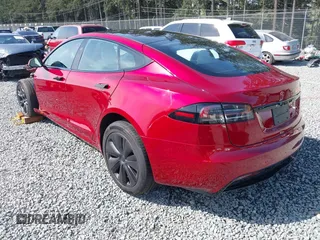 2023 Tesla Model S with VIN 5YJSA1E5XPF516779, listed as a IAAI auction lot 42110737 with 16,465 mi miles and . Bid and sale history available at DreamBid. Image 3.