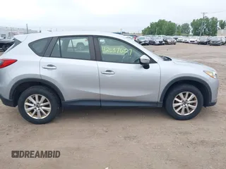 2016 Mazda CX-5 Sport z VIN JM3KE4BY1G0711602, wystawiony jako IAAI lot #42537627 z przebiegiem Nie podano mil oraz . Historia ofert i sprzedaży dostępna na DreamBid. Obrazek 13.