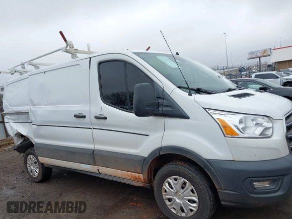 2020 Ford Transit Cargo z VIN 1FTBR1Y86LKA30515, wystawiony jako IAAI lot #41441522 z przebiegiem 84 331 mil mil oraz . Historia ofert i sprzedaży dostępna na DreamBid. Obrazek 13.