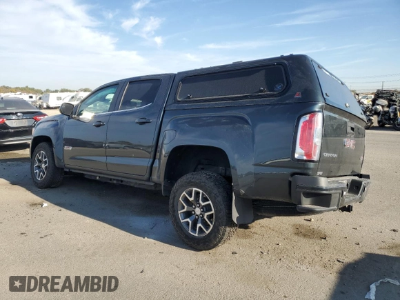 2017 GMC Canyon z VIN 1GTP6CE1XH1252005, wystawiony jako Copart lot #74982794 z przebiegiem 62 797 mil mil oraz Szkoda całkowita • Salvage title. Historia ofert i sprzedaży dostępna na DreamBid. Obrazek 2.