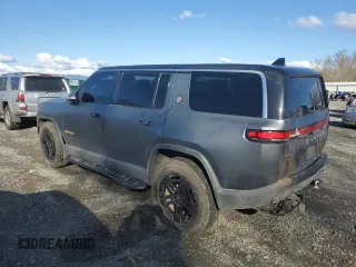 2022 Rivian R1S Launch Edition with VIN 7PDSGABL1NN000514, listed as a Copart auction lot 77444184 with 29,490 mi miles and Salvage Title. Bid and sale history available at DreamBid. Image 2.