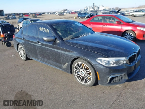 2018 BMW 5 Series M550i xDrive with VIN WBAJB9C59JG463948, listed as a IAAI auction lot 41845989 with 99,385 mi miles. Bid and sale history available at carsss.com. Image 1.