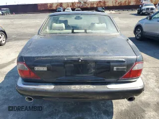 2003 Jaguar XJ with VIN SAJDA15B63MF52618, listed as a Copart auction lot 64336415 with Not provided miles and Clean title. Bid and sale history available at DreamBid. Image 6.